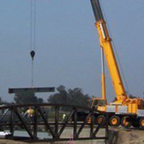 Crane Holding Huge Metal Part — Hesperia, CA — KAT Cranes