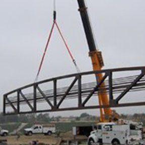 Crane Holding Bridge Piece — Hesperia, CA — KAT Cranes