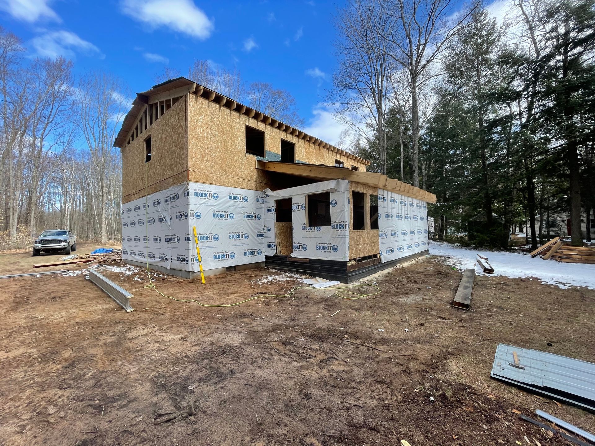 A house is being built in the middle of a forest.