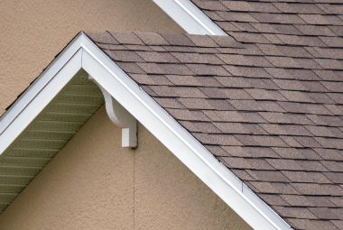 A close up of a roof with a white trim