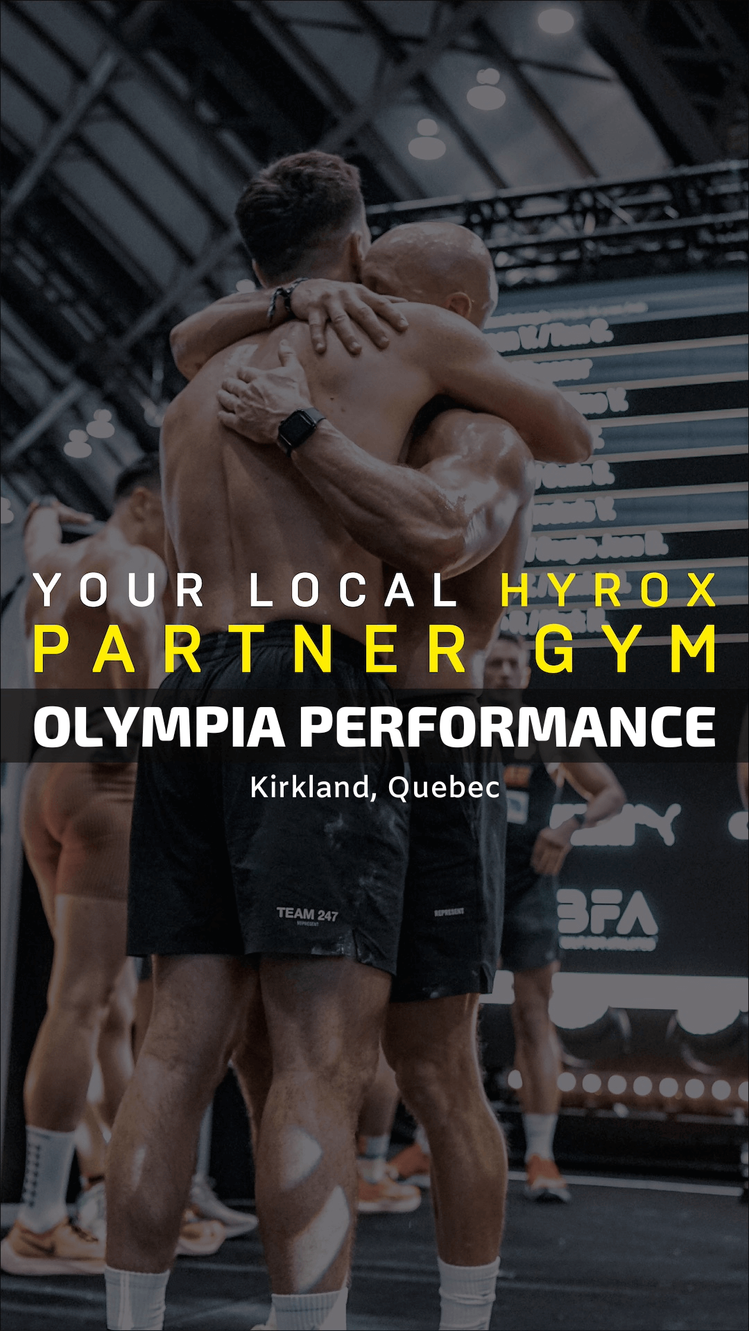 A group of men are hugging each other at the finish line of a HYROX competition