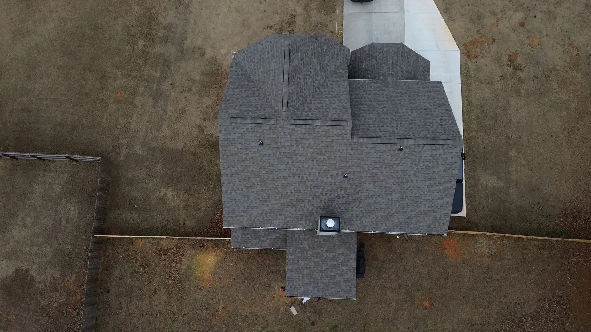 An aerial view of a house with a heart shaped roof.