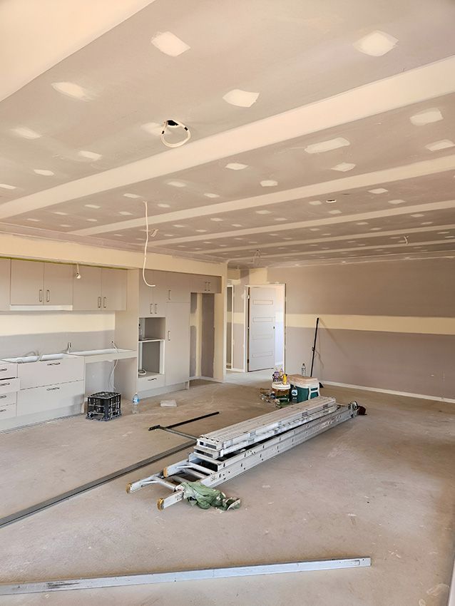 There is a Ladder and Paint Bucket in the Middle of the Room — Chops Painting in Coral Cove, QLD