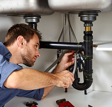 Local Plumber  —  Plumber with tools doing reparation in Baton Rouge, LA