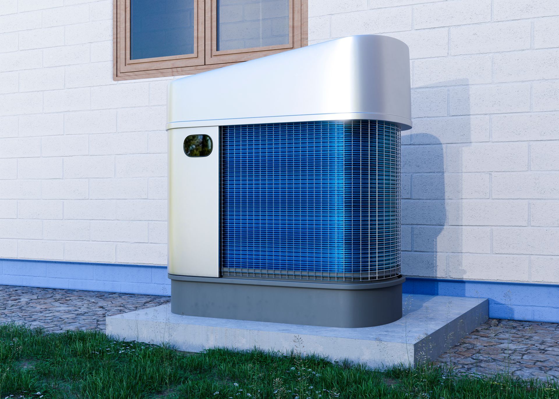 Heat pump unit mounted on a concrete pad beside a white brick wall and window.