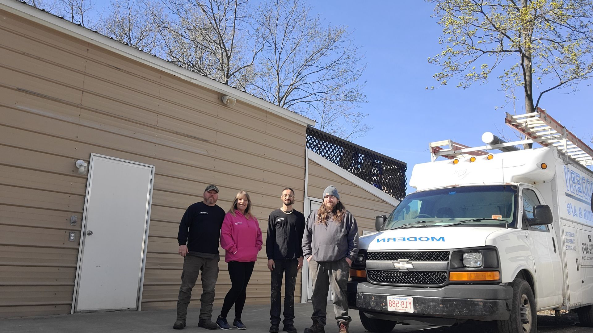 A group of people standing in front of an ambulance