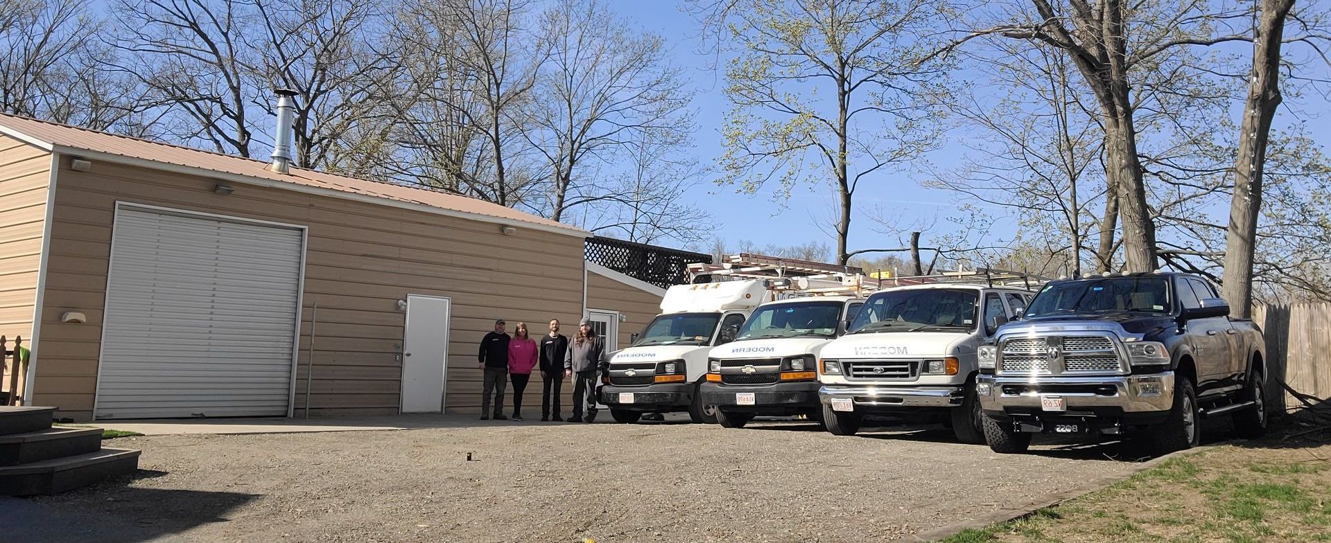 A group of people standing in front of a van that says ' ambulance ' on it