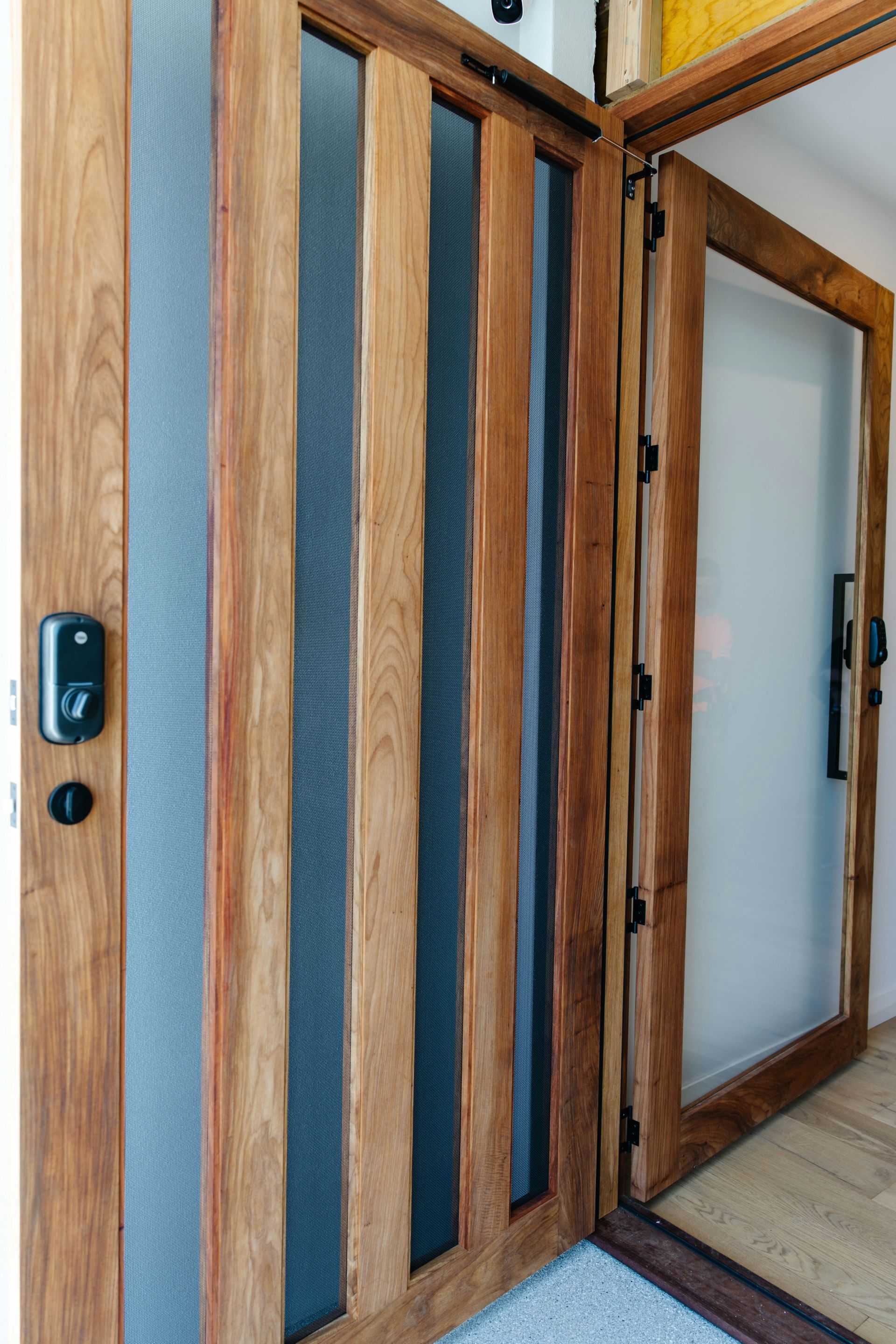 A living room with a couch , chair , coffee table and fireplace.