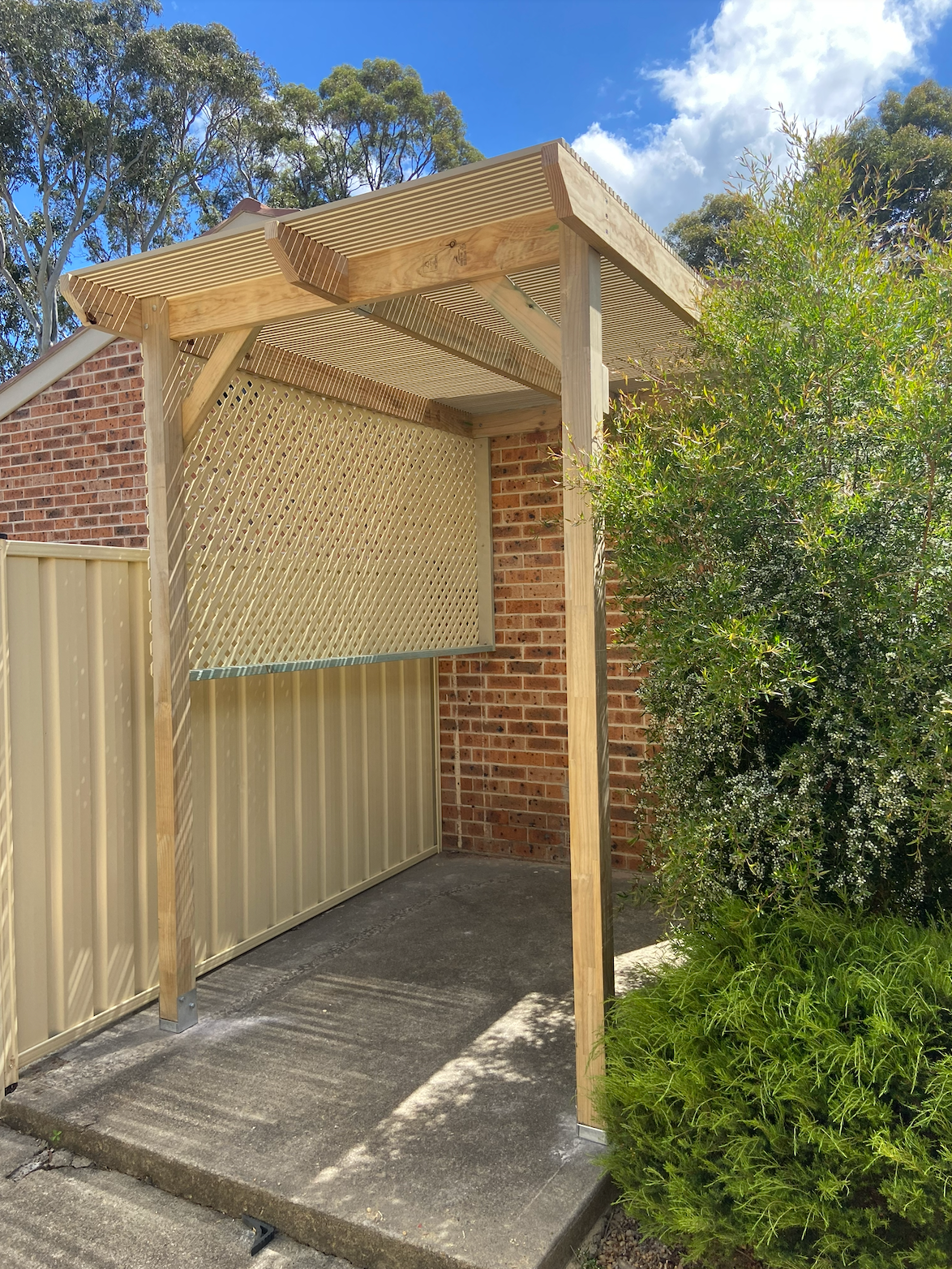 A patio with a table and chairs under a pergola
