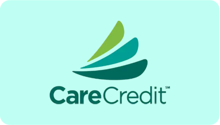 The logo for carecredit is a green sailboat on a blue background.