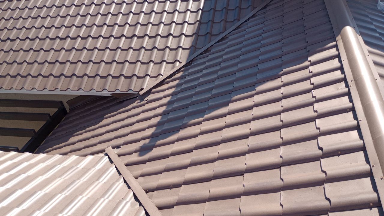 A close up of a roof with a shadow on it