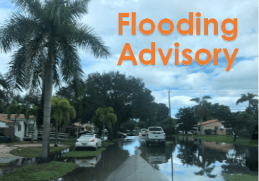 A flooded street with the words flooding advisory above it