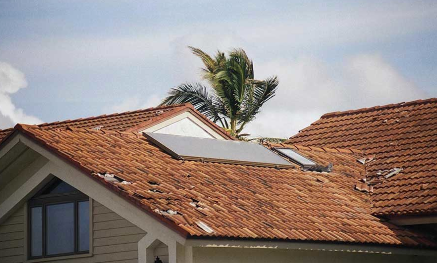 A house with a solar panel on the roof