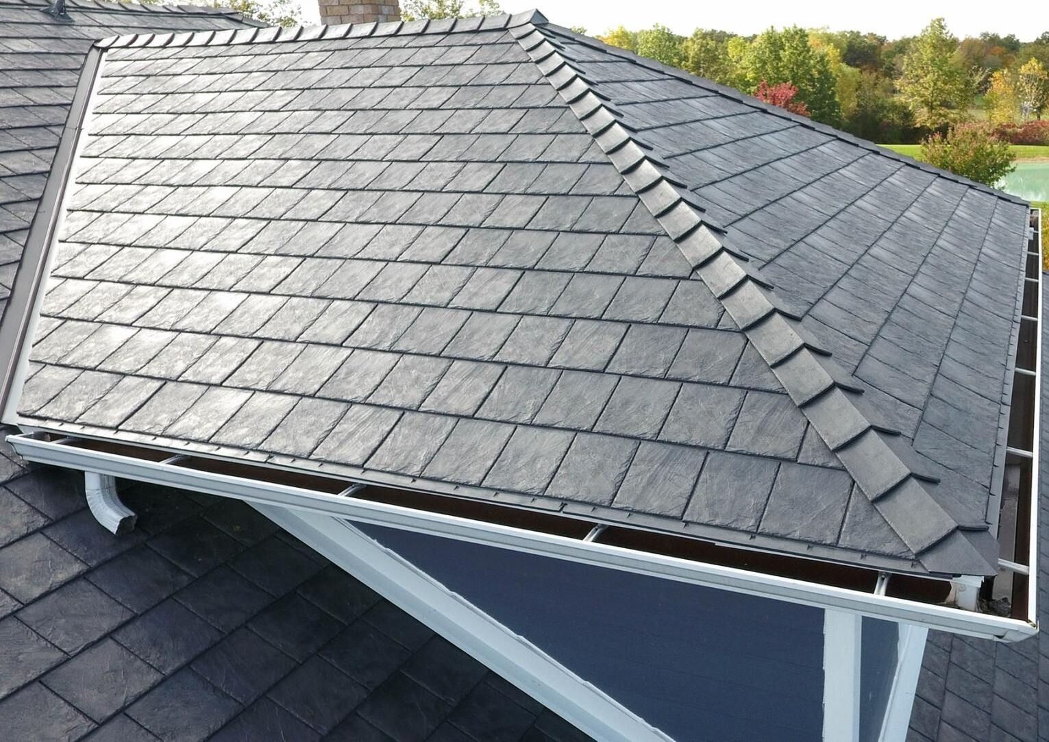 A roof with a gutter on the side of it