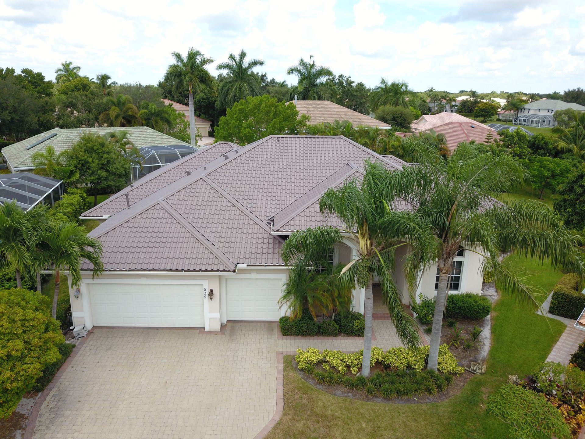 An aerial view of a house with a tiled roof
