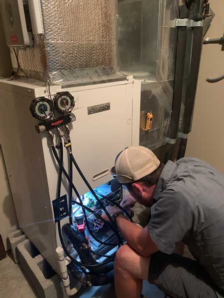 man installing geothermal