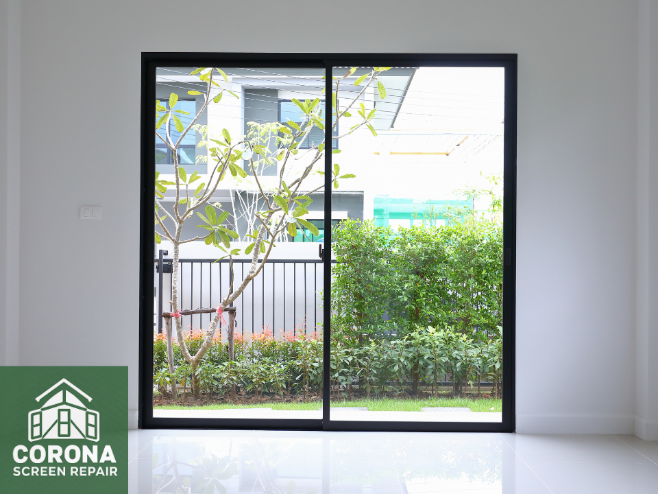 black framed sliding glass door with sliding screen door replaced by Corona Screen Repair