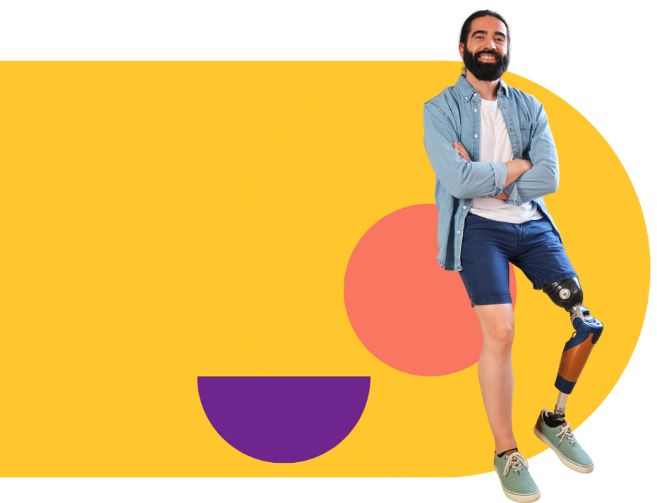 A man with a prosthetic leg is standing with his arms crossed.