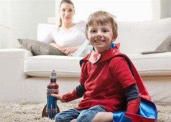 Boy sitting on carpet