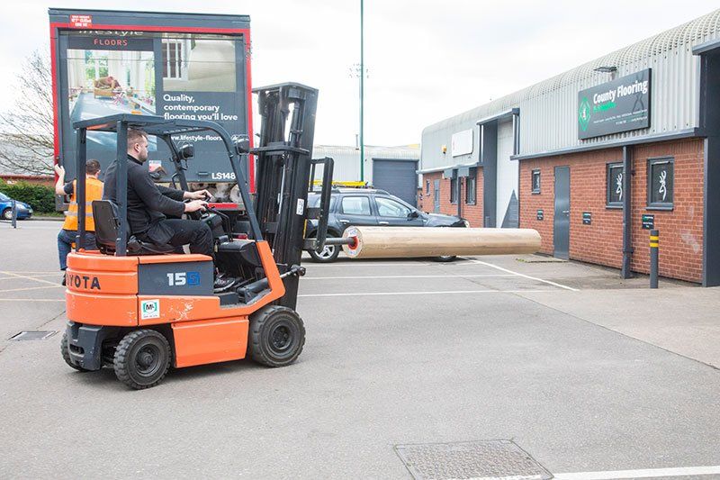 Unloading flooring at County flooring & supplies
