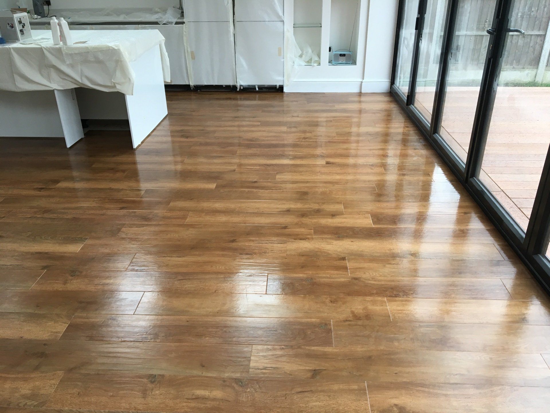 wooden flooring next to patio doors