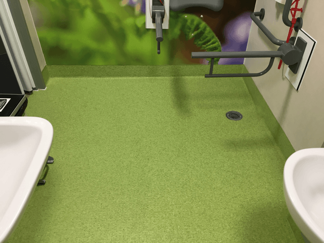 green vinyl flooring in a toilet