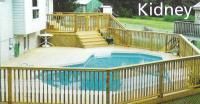 A large swimming pool surrounded by a wooden deck.