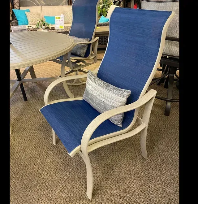 A Blue and White Chair with A Pillow on It