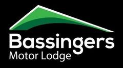 The bassingers motor lodge logo is green and white on a black background.