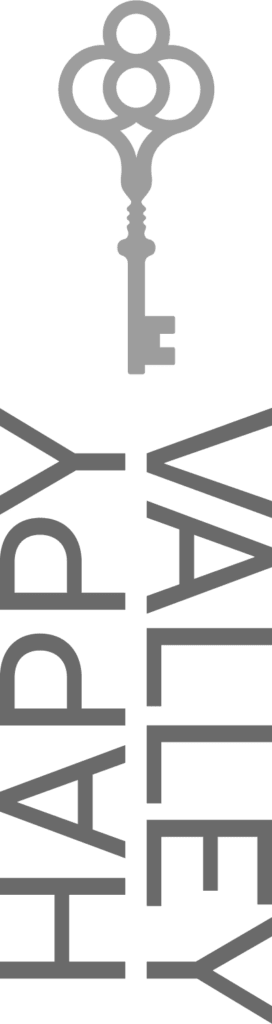 A key is sitting on top of the word happy valley.