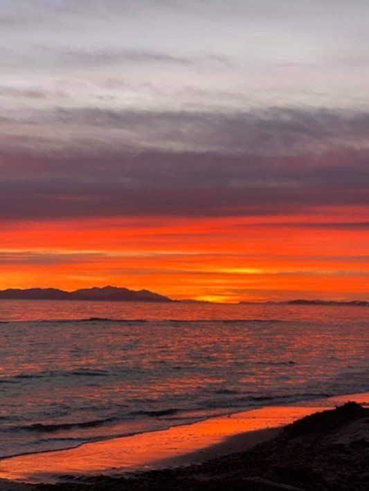 resort restaurant with a view of the sea at sunset