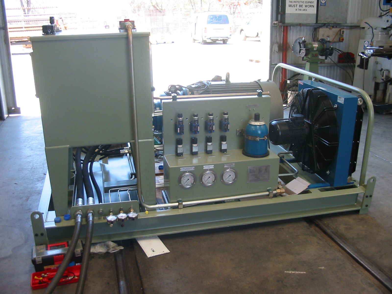 A machine is sitting on a concrete floor in a garage