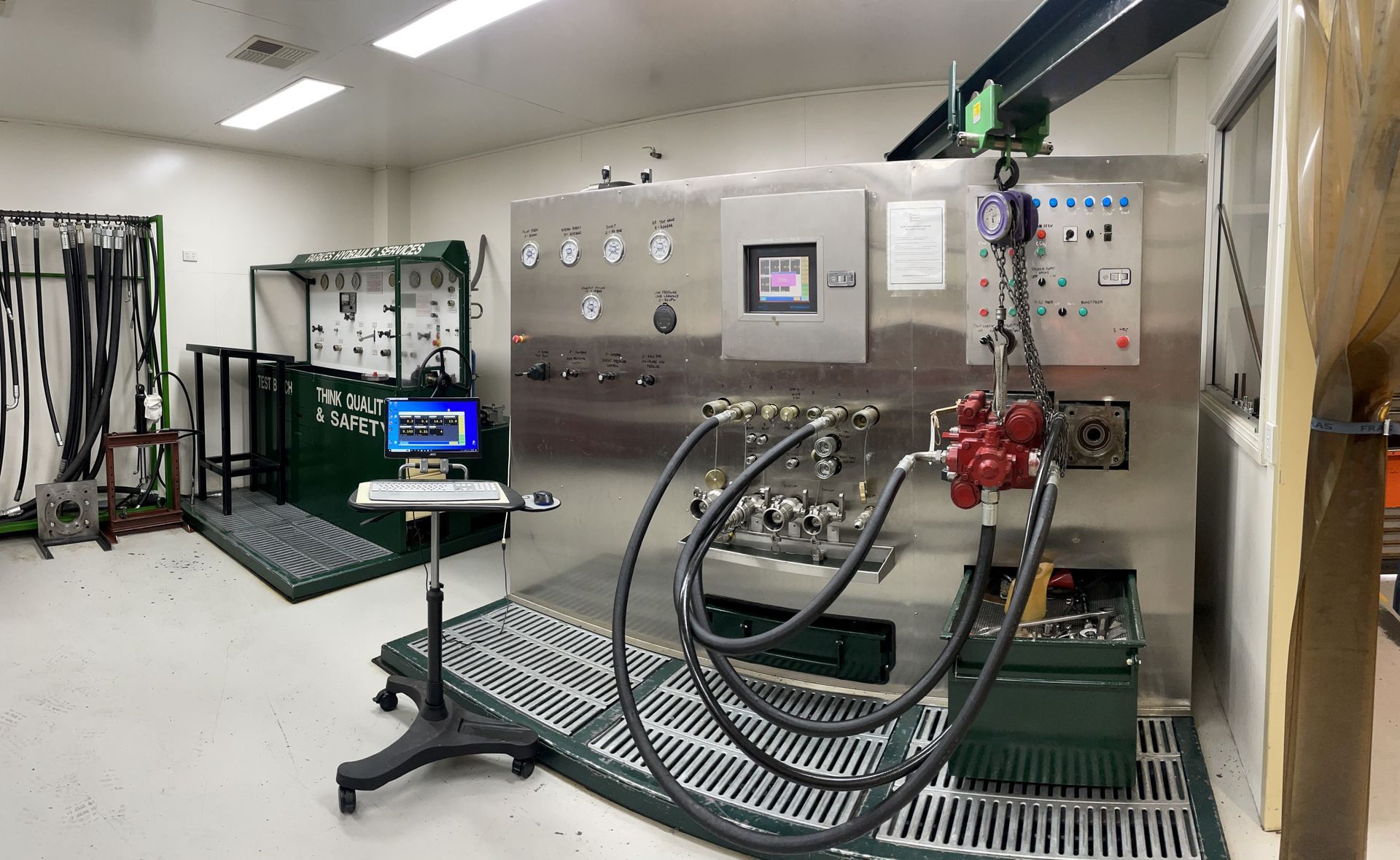 A large stainless steel machine is sitting in a room.