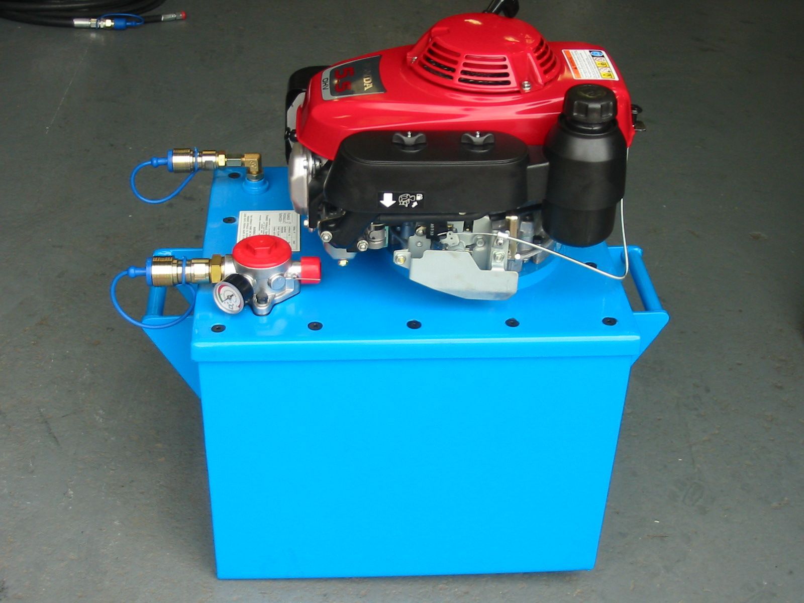 A blue box with a red honda engine inside of it