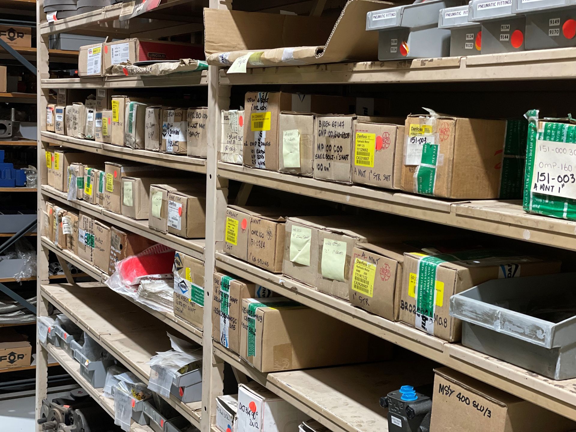 A warehouse filled with lots of boxes and shelves.