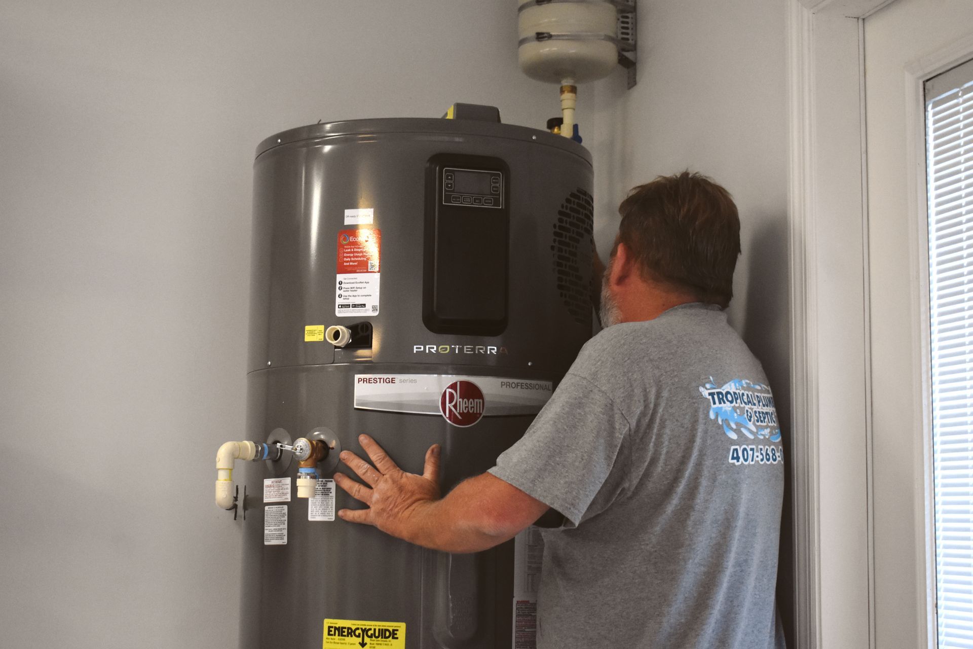 A gas meter is attached to the side of a house