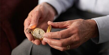Senior Man Holding Old Pocket Watch — Watch Repair in Brighton, CO