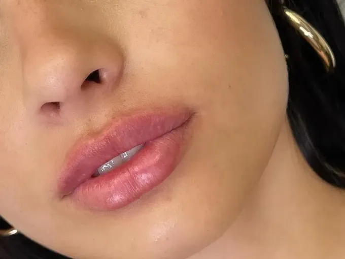 a close up of a woman 's lips and nose