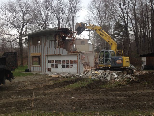 Excavator Demolishing Old House — Cranesville, PA — Brandon C. Kennedy Construction & Excavating