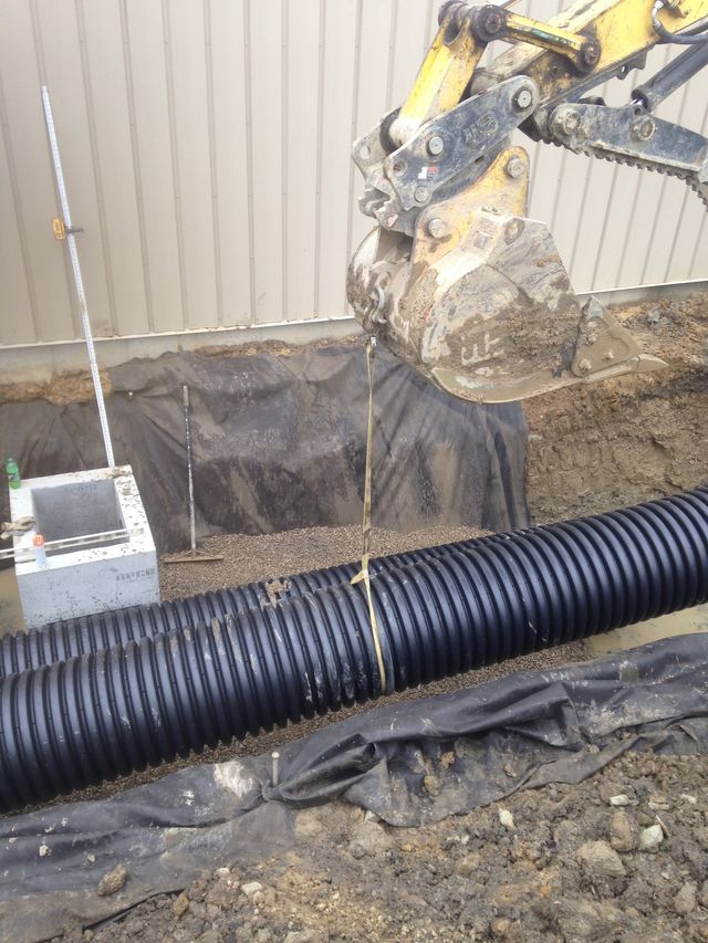 Placing Sewer Pipes — Cranesville, PA — Brandon C. Kennedy Construction & Excavating