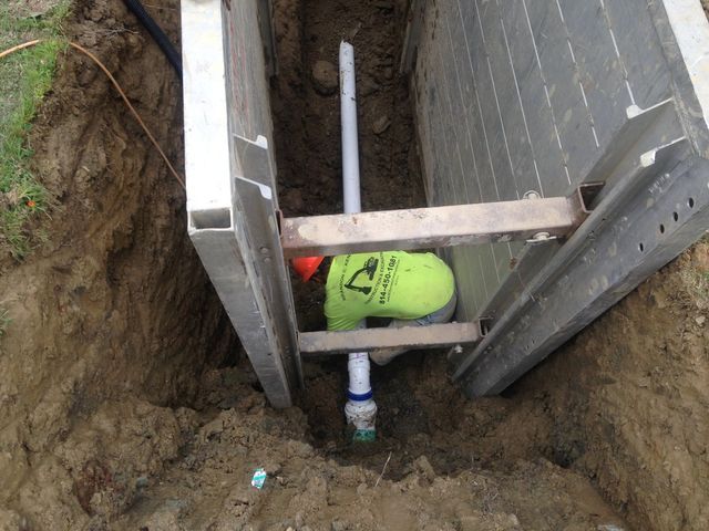 Man Working On Sanitary Sewer — Cranesville, PA — Brandon C. Kennedy Construction & Excavating