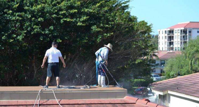 Workers working on roof — Pressure Cleaning in Seffner, FL