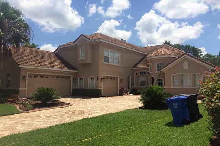 Before Cleaning the Beige House — Commercial Roof Pressure Washing Services in Tampa Bay, FL
