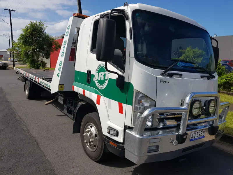 Tow Truck with signage on it — Towing Services in Tully, QLD