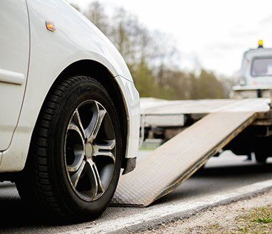 Car on a Tow Truck on a Roadside — Towing Services in Gordonvale, QLD