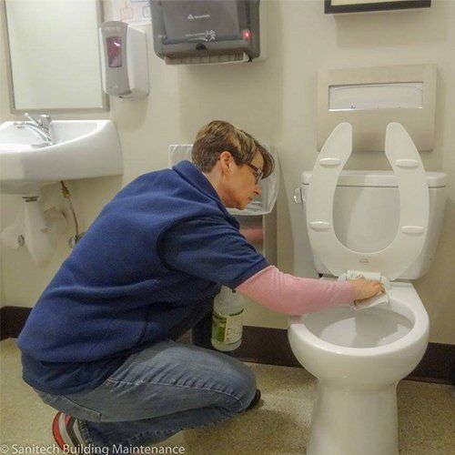 Man Cleaning Toilet — Medford, OR — Sanitech Building Maintenance