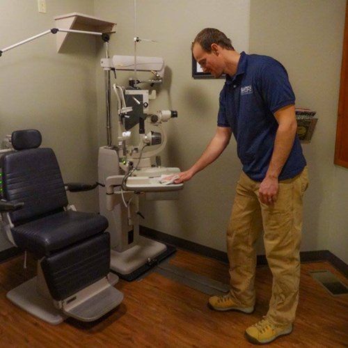 Man Cleaning Dental Equipment — Medford, OR — Sanitech Building Maintenance