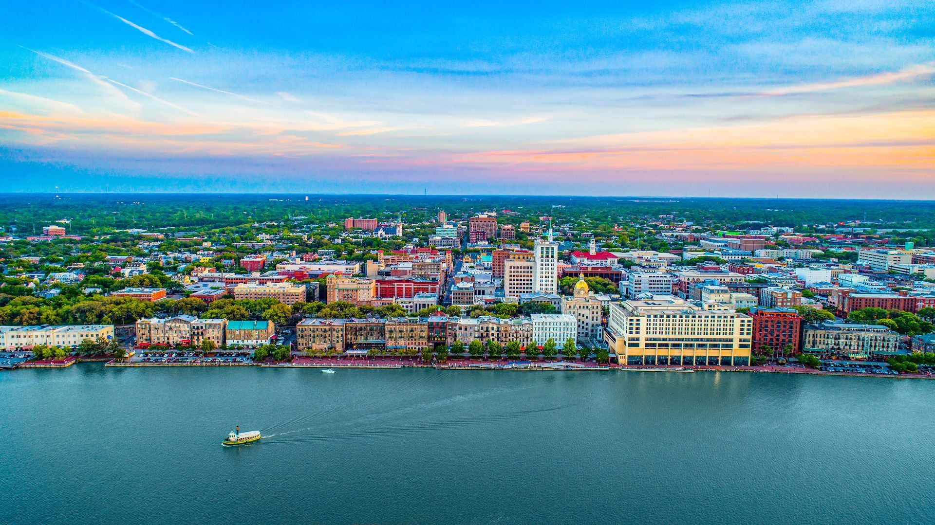 Photo of city skyline and river