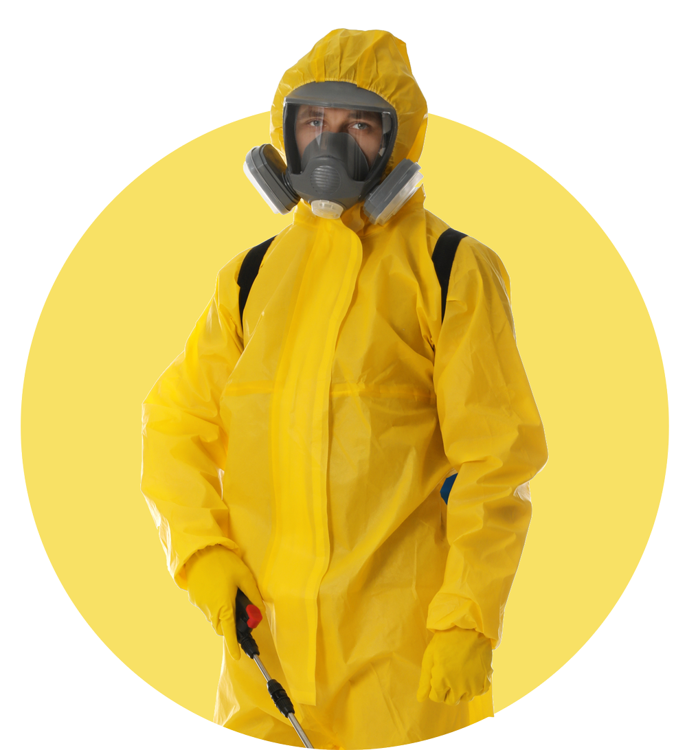 A man in a yellow protective suit and mask is holding a sprayer.