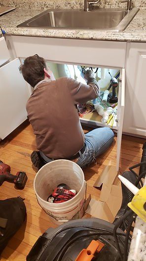 Men Fixing Sink - Hyannis, MA - Cape Cod Pro Builders and Remodeling